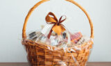 gift basket on gray background, close-up view Gourmet Gift Baskets