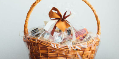 gift basket on gray background, close-up view Gourmet Gift Baskets